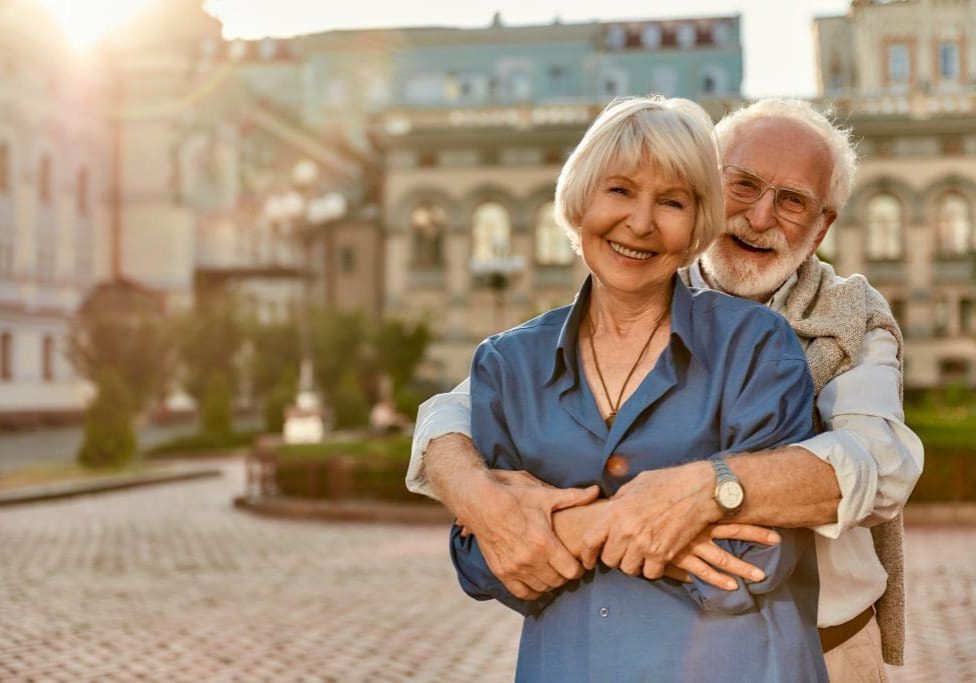 Love has no age limit. Happy senior couple in casual clothing embracing each other and smiling while standing outdoors Love has no age limit. Happy senior couple in casual clothing embracing each other and smiling while standing outdoors. Love concept. Family